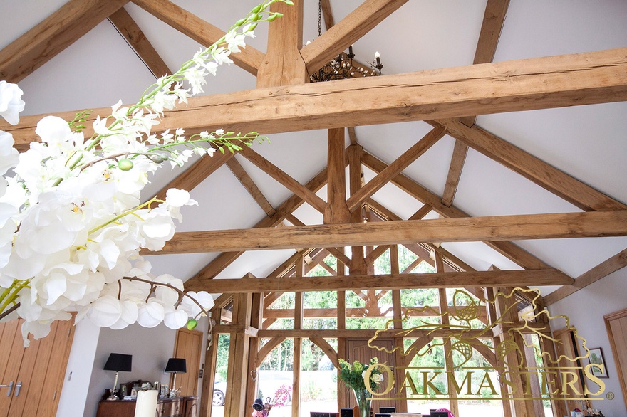A patchwork creates with multiple oak trusses and oak frame components