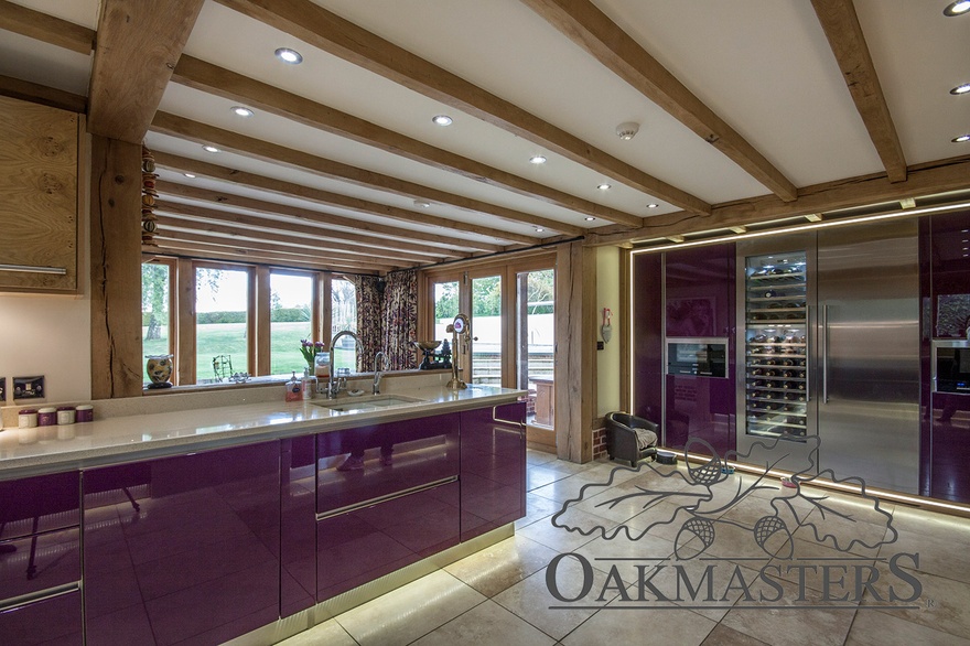 The dining area of the open plan kitchen features oak bifold doors