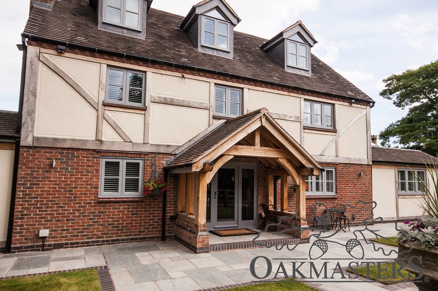 Oak framed porch and oak cladding add warmth and character to this property