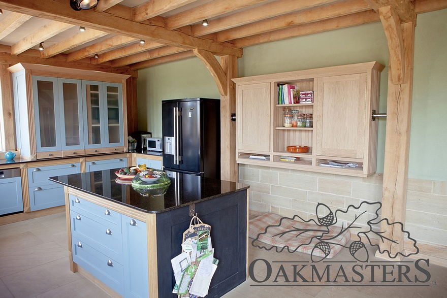 Hand made oak kitchen units  are integrated into the frame in places