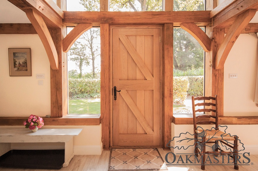 Create a grand entrance with an integrated glazed oak porch.
