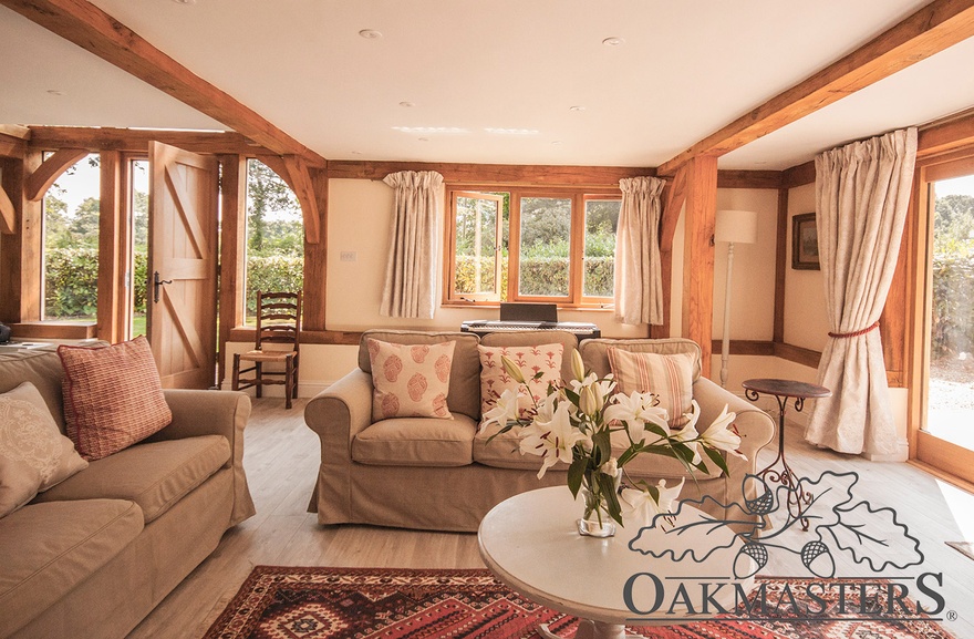 Cosy sitting room with a few oak beams overhead.