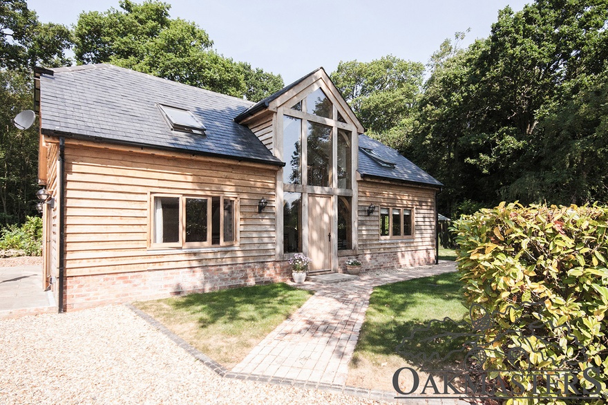 Double storey glazed gable entrance in the main feature of this lovely oak cottage. 