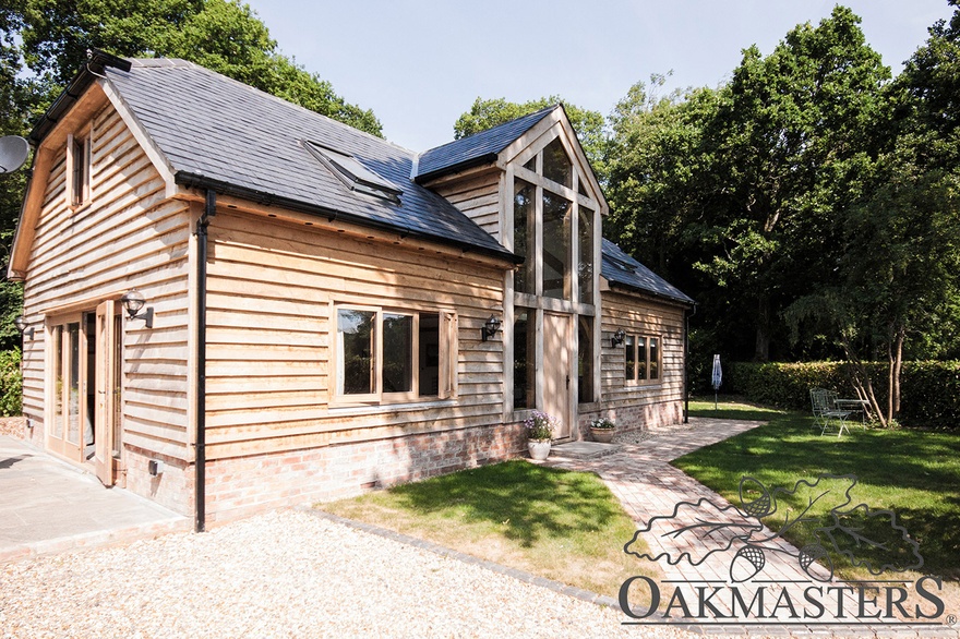 Traditionally clad oak cottage exterior.