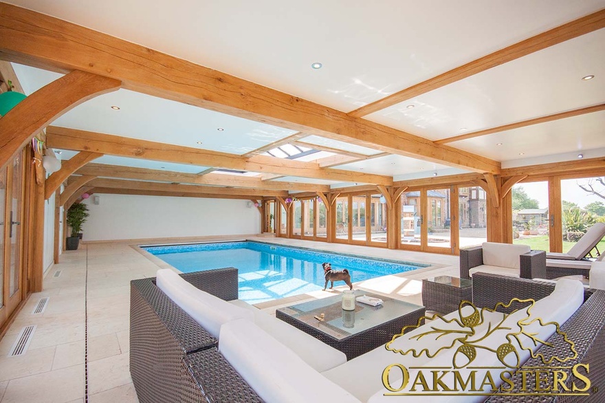 Oak framed swimming pool building with low profile flat roof