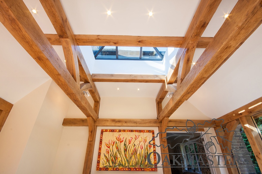 The ceiling is supported with oak half trusses and oak ceiling beams