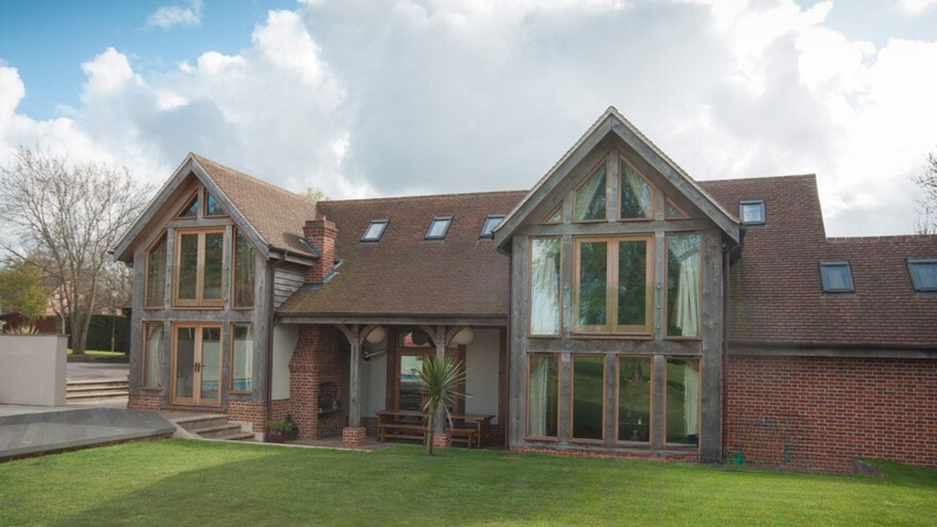 Two storey oak framed house extension, contributing to the luxury and charm of the rural property.