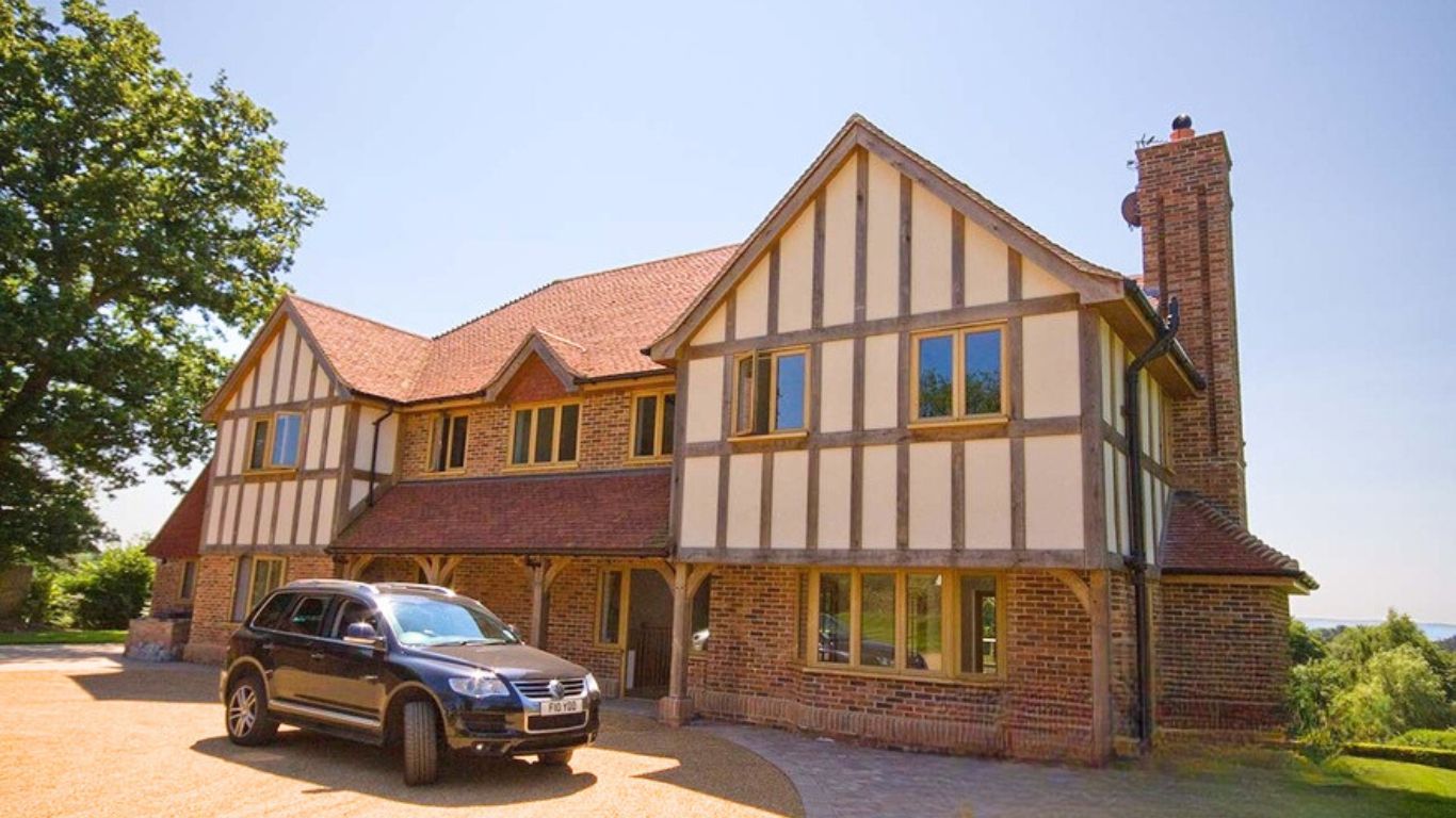 Exterior cosmetic oak cladding on a spacious Tudor-style house. 