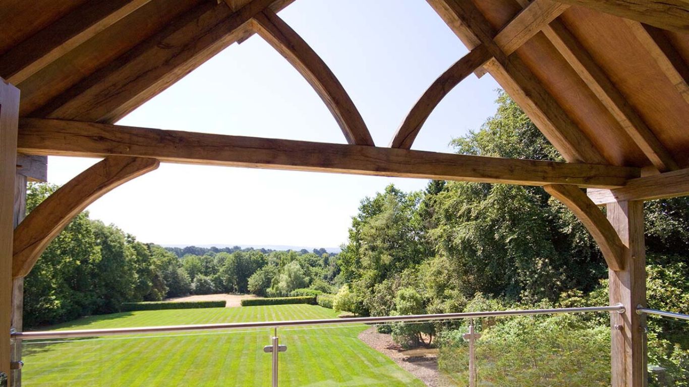 Traditional queen post truss is a curved angled queen oak post truss