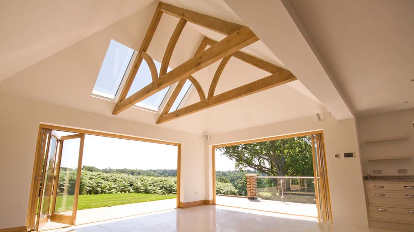 Made to order oak roof trusses.   Each oak rafter and truss is expertly designed to bring strength  and natural charm