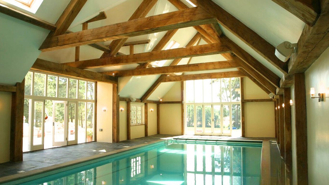 Large swimming pool with oak trusses