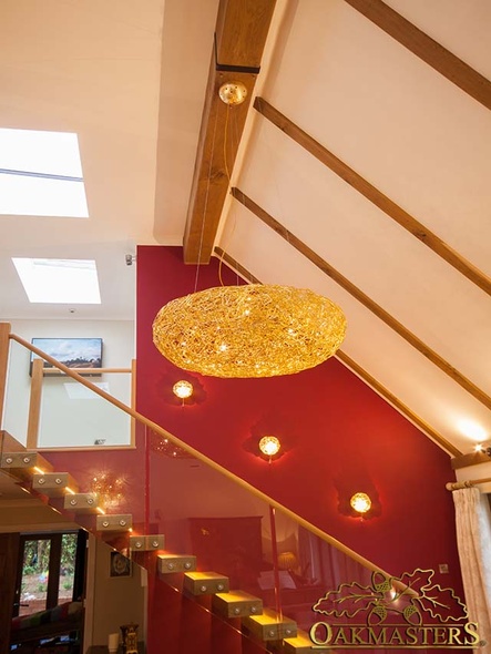 Two sided oak beam cover over a modern staircase