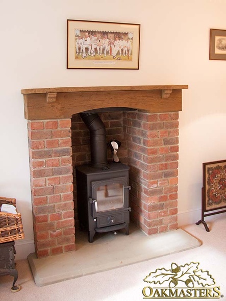 Wood burning stove with arched oak fireplace beam