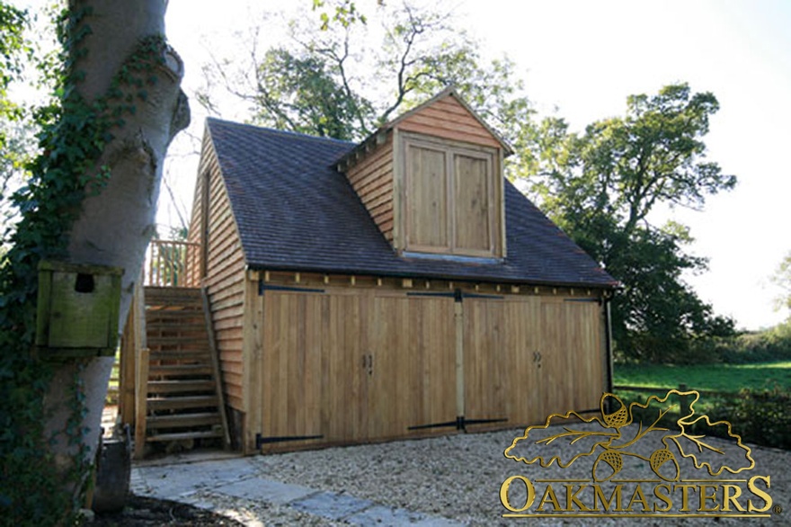 Two bay closed garage with glazed loft room