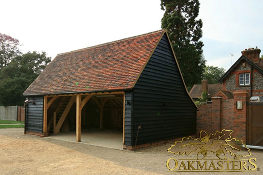 Two bay open oak garage with internal saircase