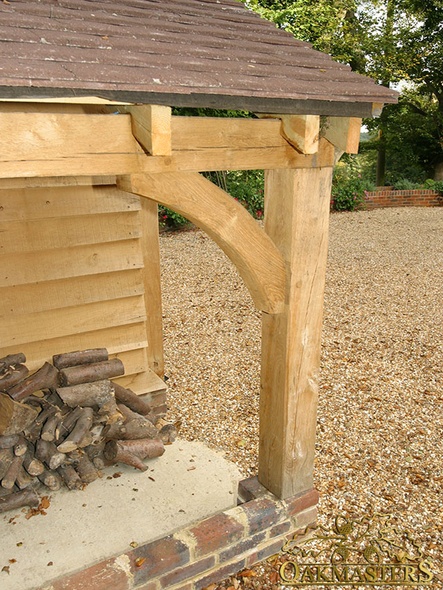 Detail of open oak log store post and bracket