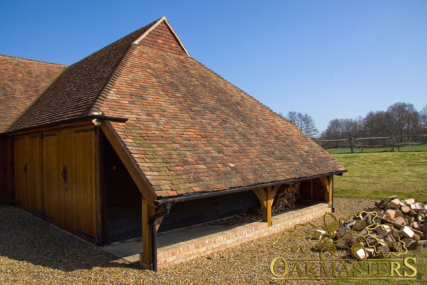 Three bay oak framed garage with gablet hip and cat slide