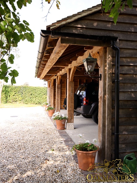 Three open bays of an oak garage