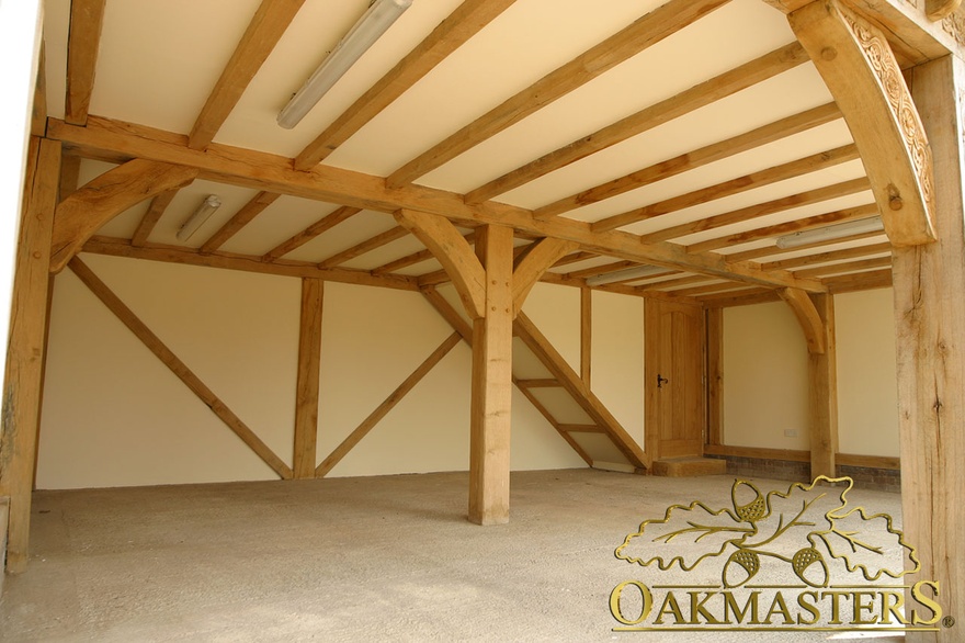 Internal view of a large three bay oak framed garage space