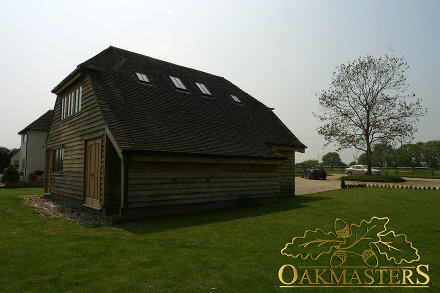 Rear view of oak clad garage with loft