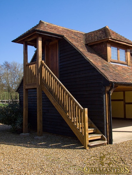 Detail of a side oak staircase with small porch