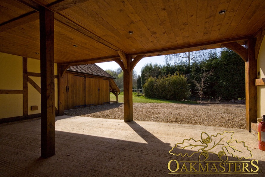 View out of an open 5 bay oak framed garage