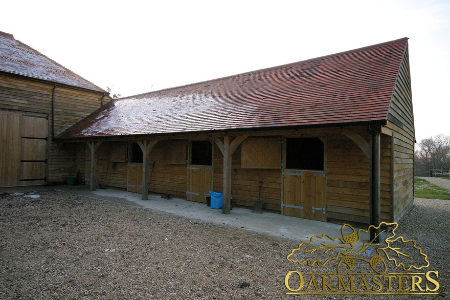 Oak framed stables with covered walkway