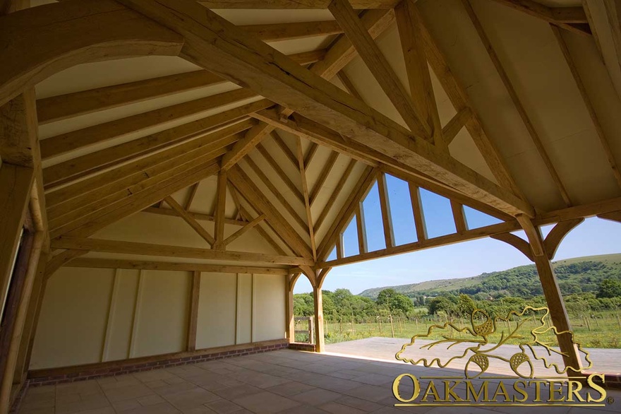 Detail of complex oak roof structure with exposed rafters