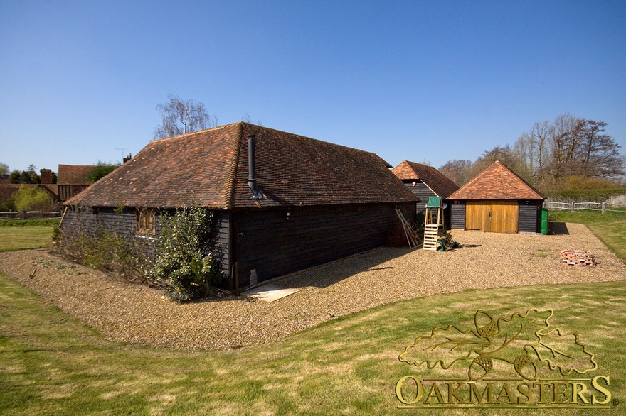 Rear view of an L shaped oak garage complex