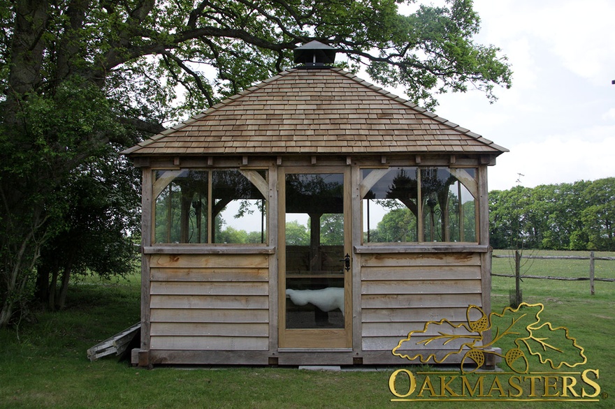 Entrance to part oak clad detached grill-house