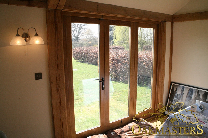 Oak framed glazed patio doors in garden house