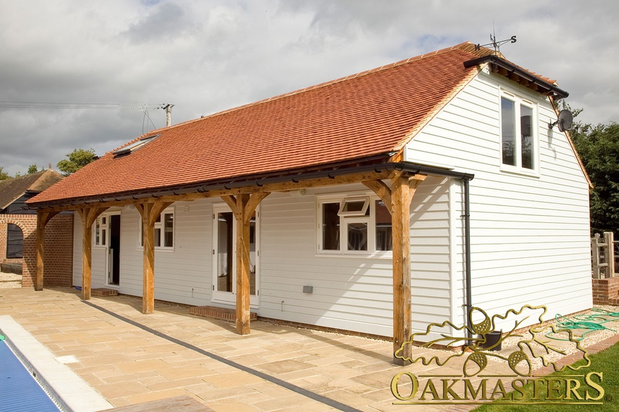 Handcrafted oak beams and curved braces on roof extension at leisure complex