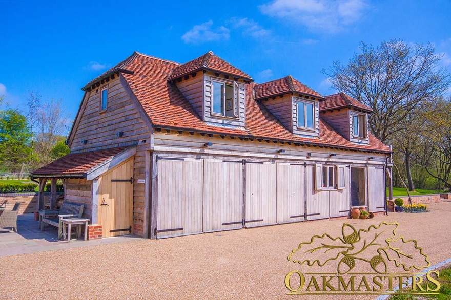 Double garage with oak doors and traditional door braces on country retirement house