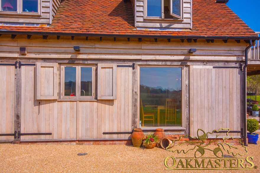 Oak window shutters beside oak framed window on bijou retirement home