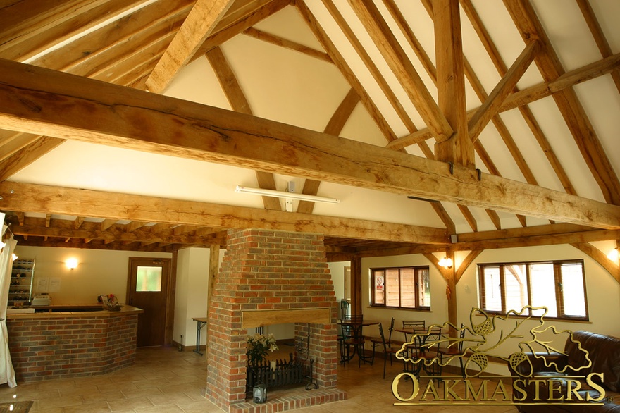 Corporate entertainment suite with exposed king post oak-truss and rafters