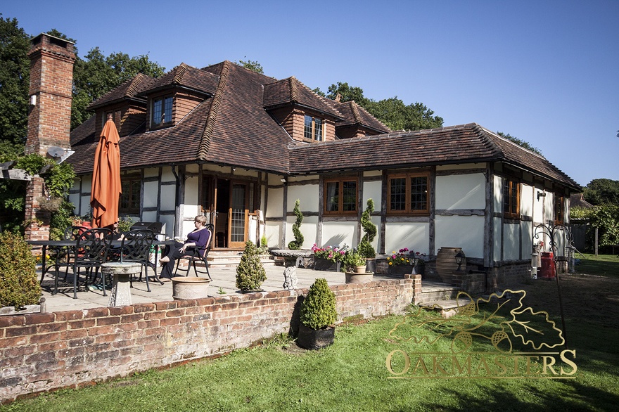 Exterior of dining room extension using reclaimed oak to match existing property