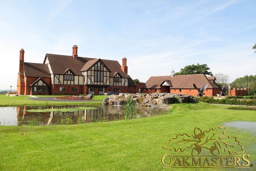 Oak frame Tudor style family home with glazed gables and exposed timber frame