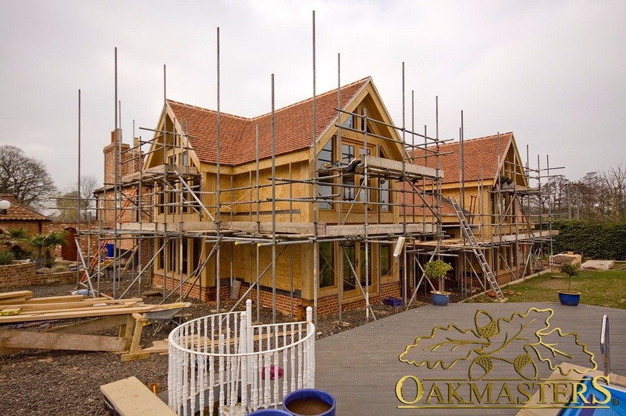 Oak-framed gables partly glazed on large house extension