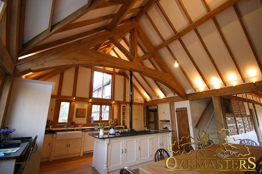 Hand crafted oak truss above listed house kitchen extension