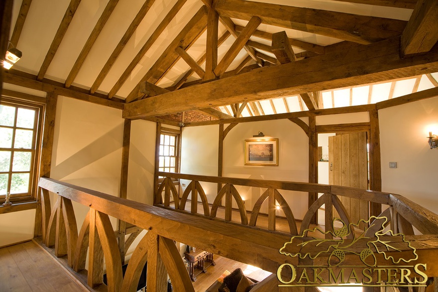 Exposed bespoke king post truss above upper hallway