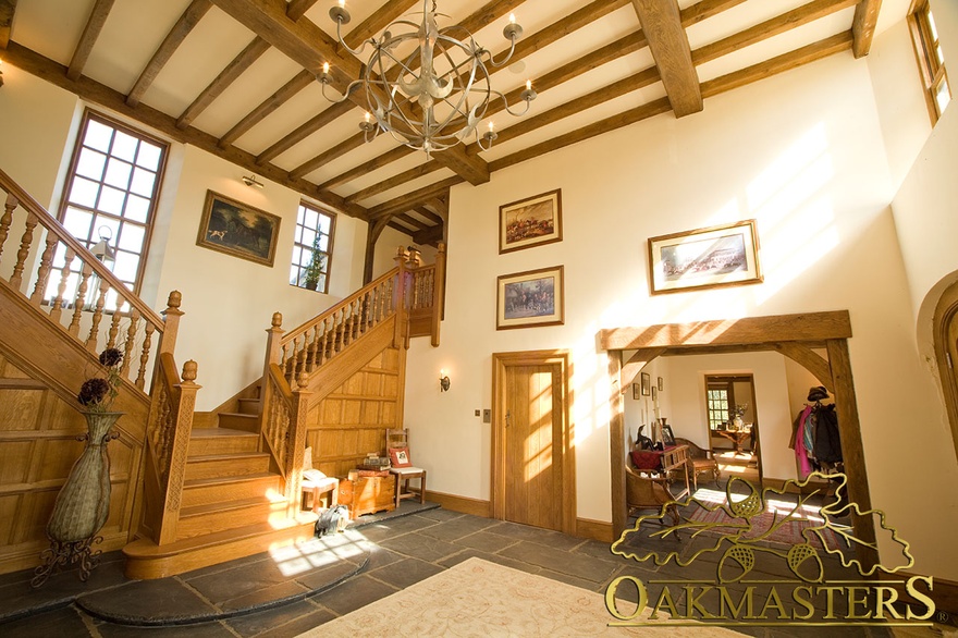 Oak lintel frames adjoining room from hallway in manx oak and stone house