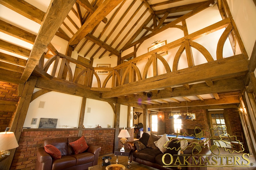 Gallery style upper hallway with manx oak carved balustrade and exposed oak beam open ceiling