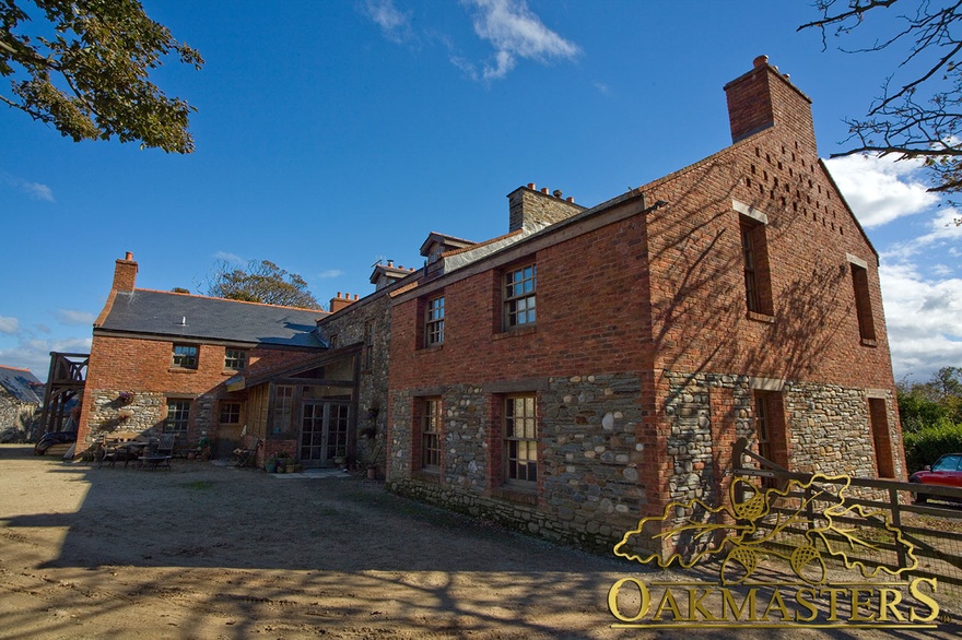 Exterior of Isle of Man manx oak and stone house with oakframe windows