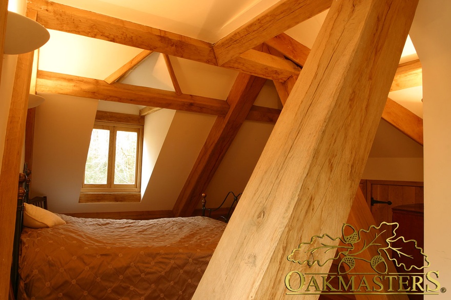 Bedroom amongst eaves in modern country house extension