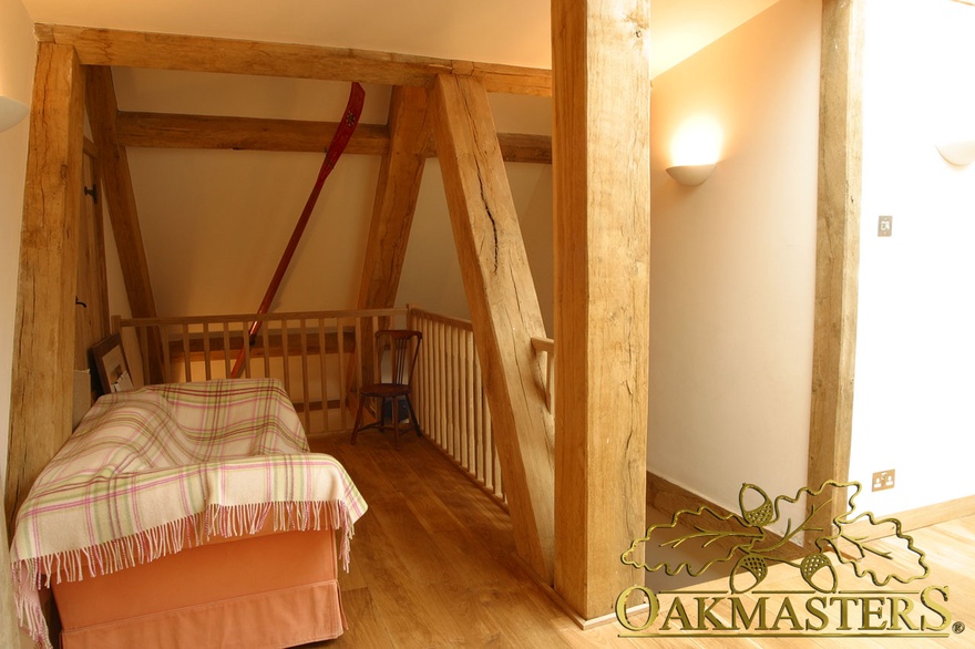 Exposed ceiling truss forms part of upstairs balustrade in country home extension