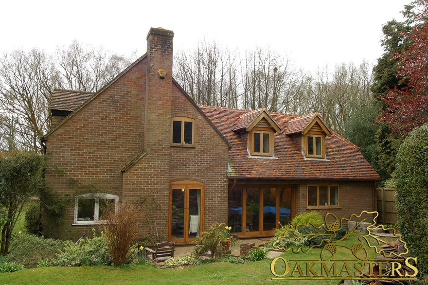 Exterior showing modern extension integrating with existing country house
