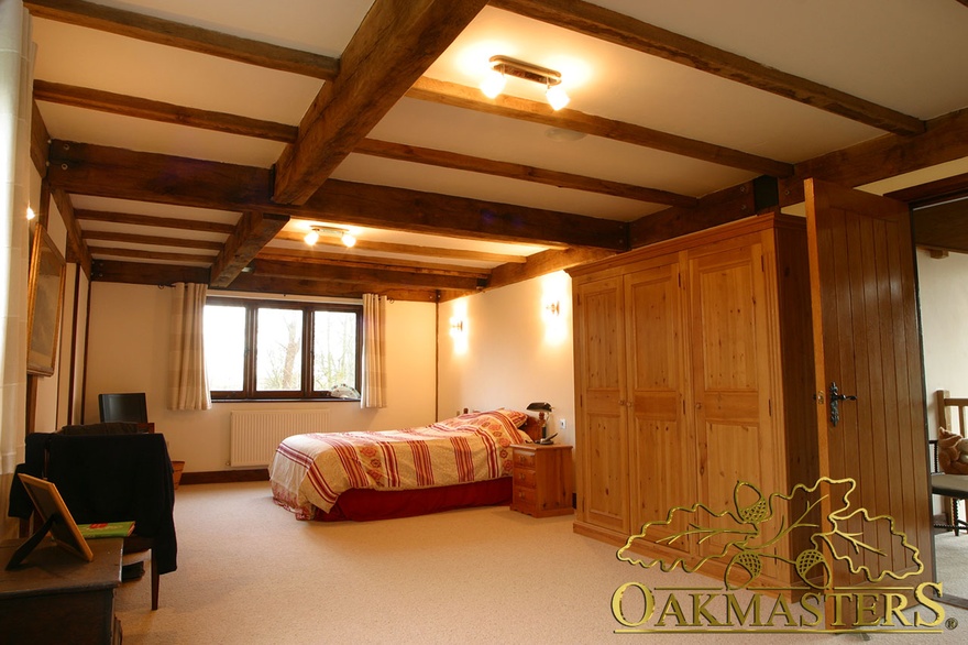 Exposed oak beams in oak and steel jointed home