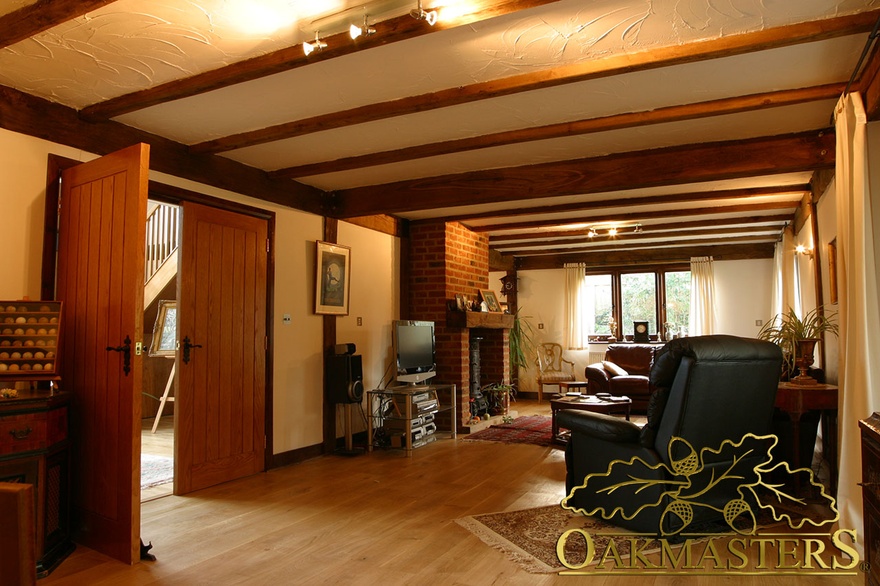 Sitting room in oak and steel jointed house