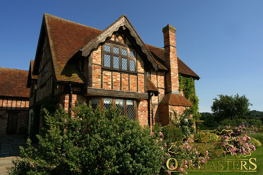 Projecting roof with reclaimed oak timber cladding