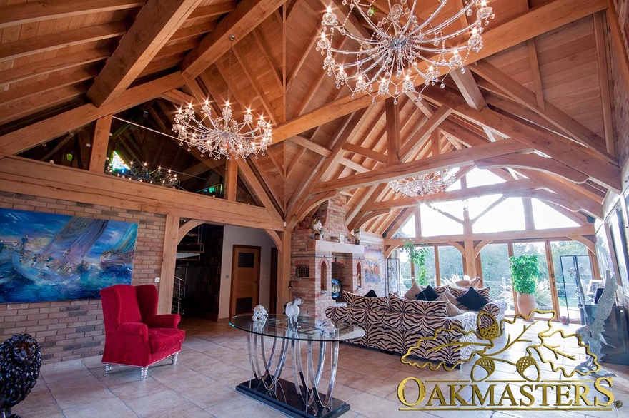 Sitting room in single storey residence with large vaulted ceiling and glazed first floor gallery